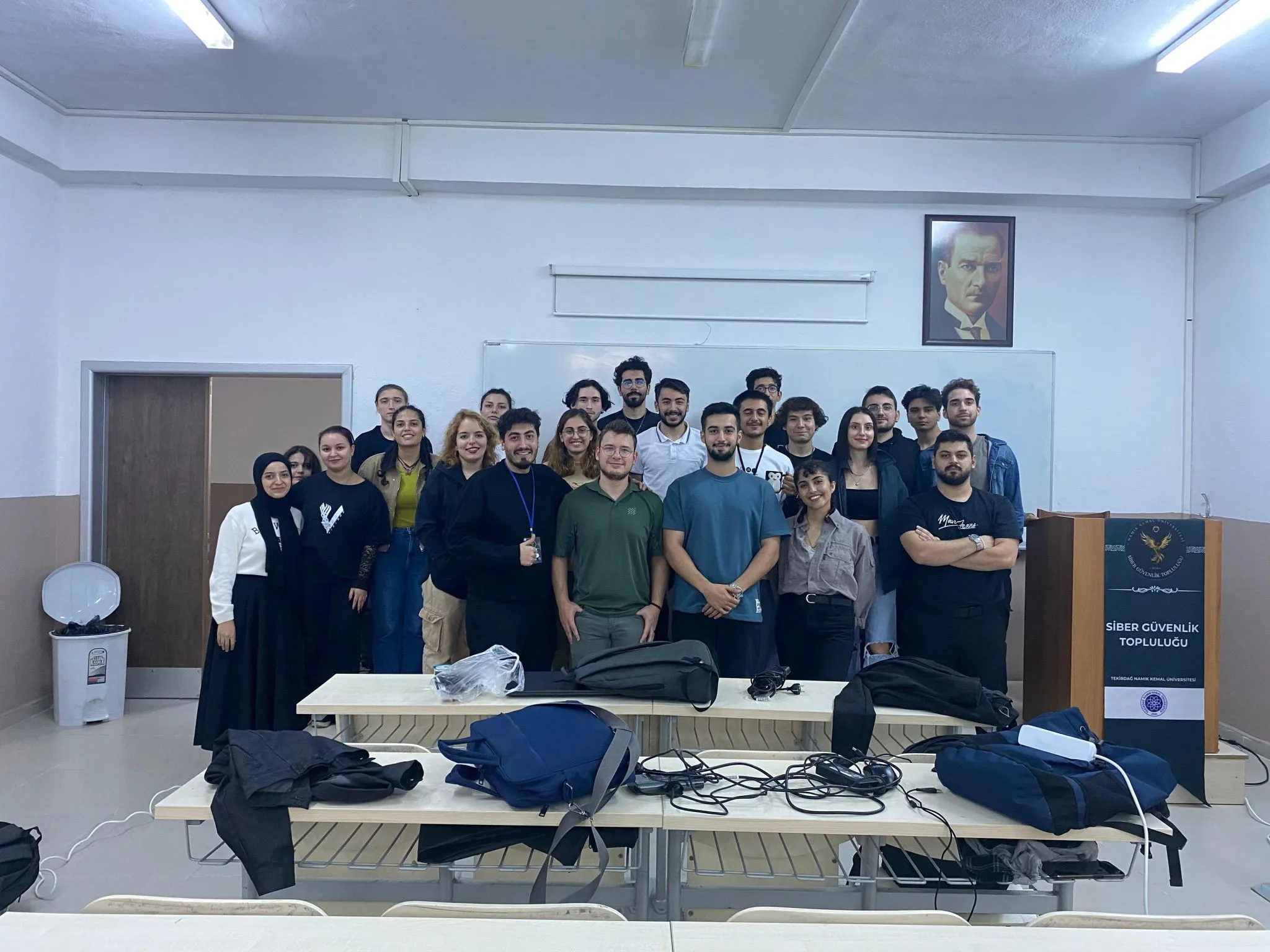 Class of people standing in front of the board